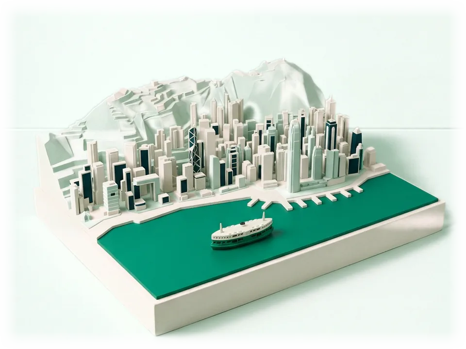 Model of Hong Kong harbour: a white and emerald Star Ferry on the water, behind it a dense row of skyscrapers at the foot of a steep ridge
